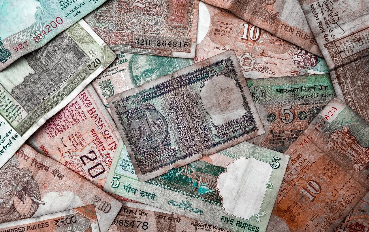 The Art of Drawing Readers In: Your attractive post title goes here A collection of diverse vintage Indian rupee notes showcasing various denominations and designs.