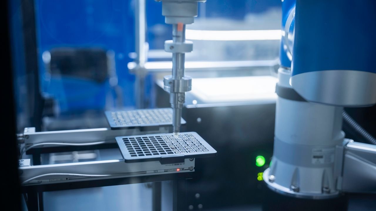 Crafting Captivating Headlines: Your awesome post title goes here Close-up of robotic arm automating lab processes with precision.